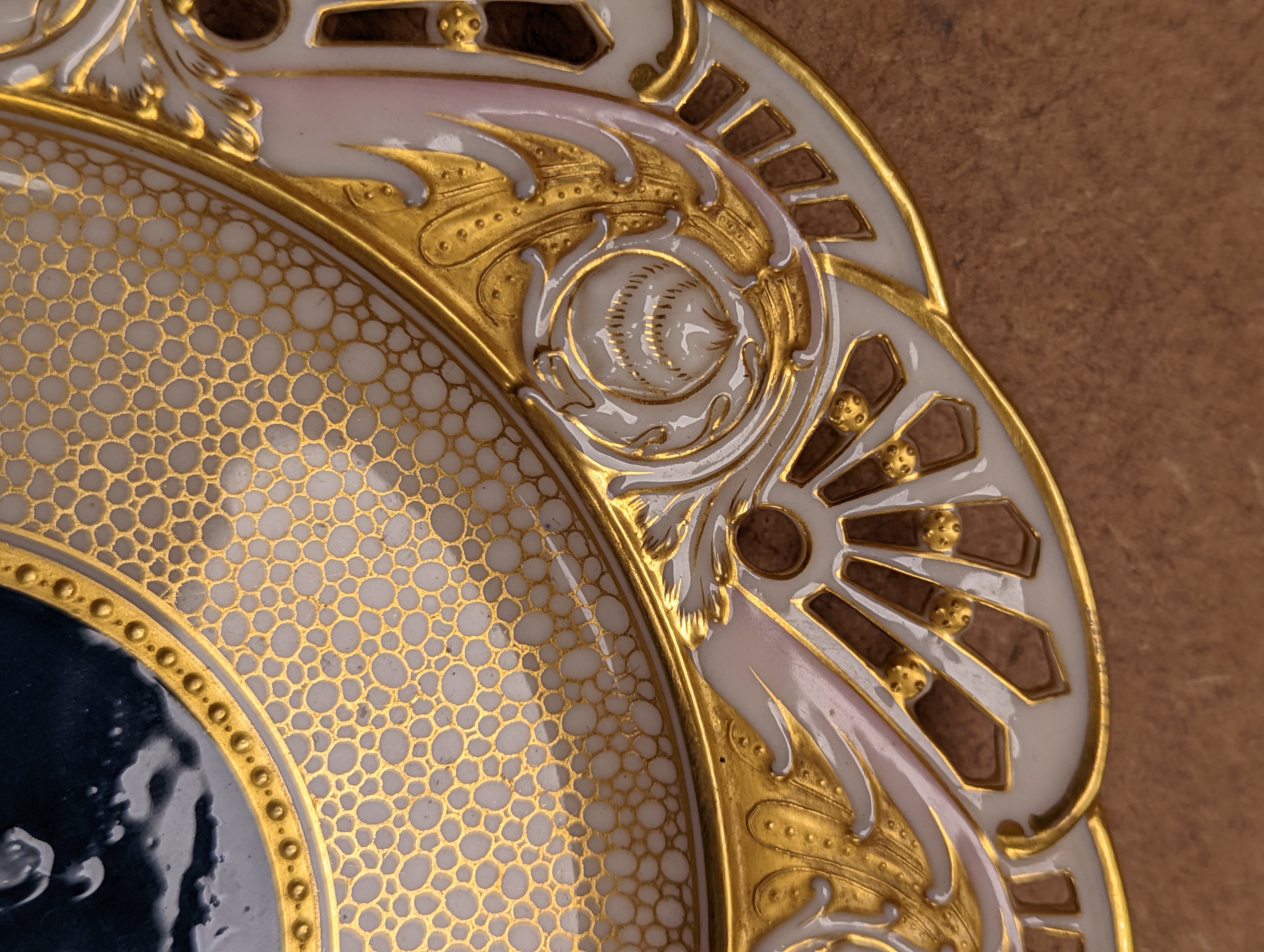 A Mintons pate sur pate cabinet plate, attributed to Alboin Birks, c.1905, diameter 23cm